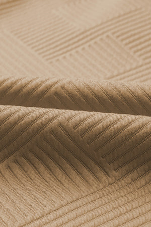 Tan textured polo set fabric with wide-leg culotte detail