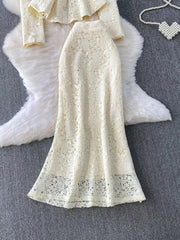 Cream lace peplum top and midi skirt set with ornate floral pattern and scalloped hem.