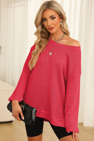 Waffle knit oversized top in strawberry with slit hem and off-the-shoulder neckline.