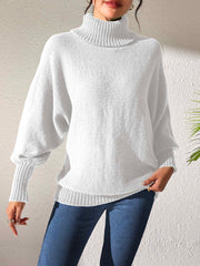 White balloon sleeve turtleneck sweater with relaxed knit and ribbed cuffs.