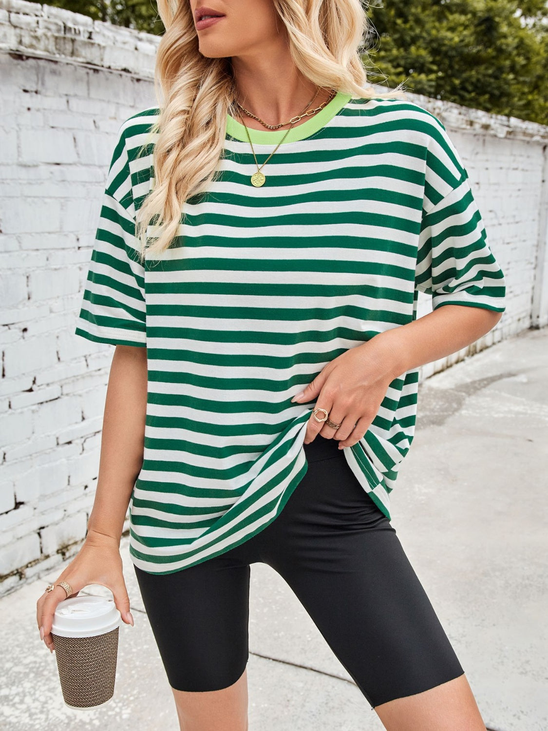 Relaxed fit striped tee in green and white with a contrast lime green neckline.