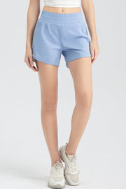 Light blue layered performance running shorts with elastic waistband and curved hem