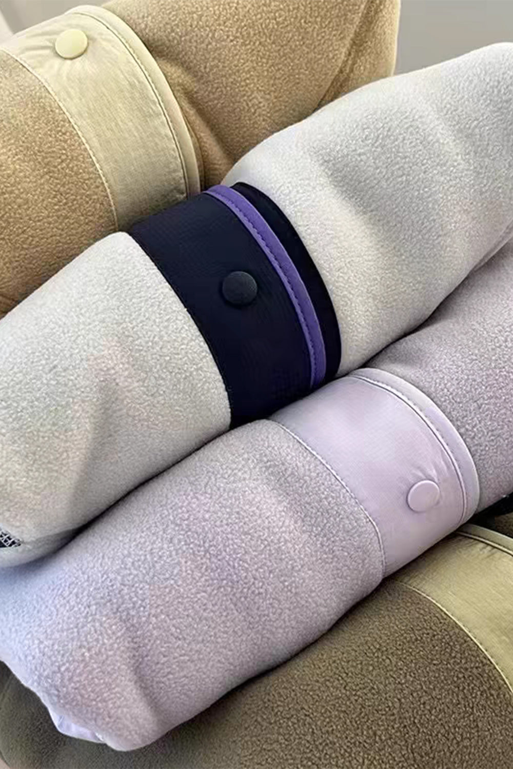 Fleece bomber jacket with contrast trim, snap button details, and plush texture.