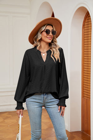 Black eyelet detail blouse with poet sleeves and v-neck