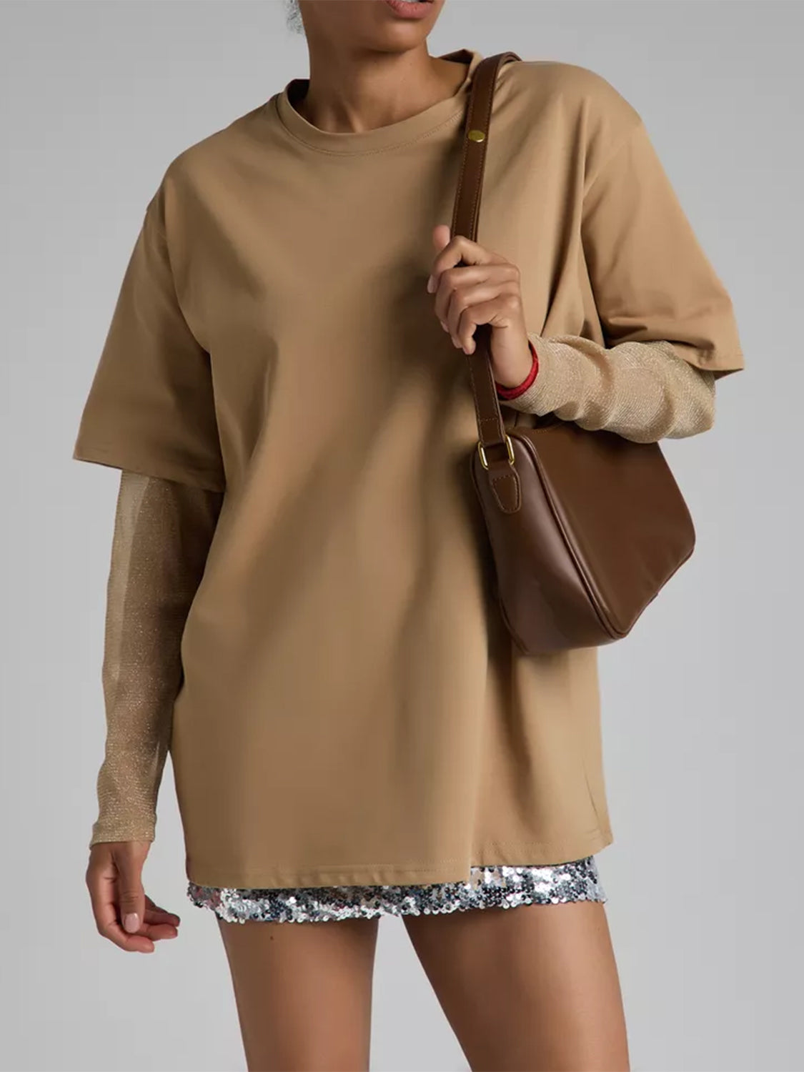 Oversized camel tee with sheer sleeves and a sequin hem detail.