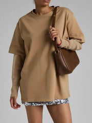 Oversized camel tee with sheer sleeves and a sequin hem detail.