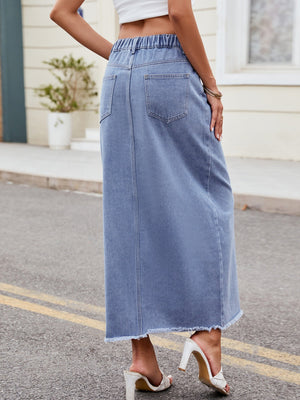 Light denim midi skirt with elastic waist, pockets, and frayed hem.