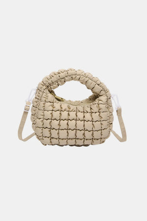 Padded crescent crossbody bag in Khaki with sculptural texture and ruched handle.