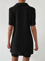 Black ribbed polo shirt and shorts set with short sleeves and a collar.