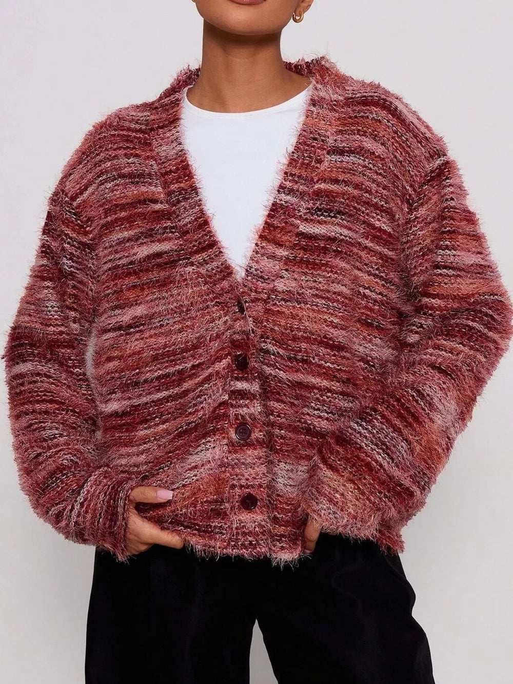 Cozy textured knit cardigan in rust with a V-neck and button-down closure.