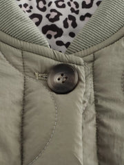 Lined quilted button-down jacket in moss with leopard print lining and ribbed collar.
