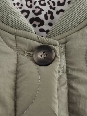 Lined quilted button-down jacket in moss with leopard print lining and ribbed collar.