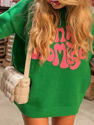 Green knit sweater with pink "Pinky Promise" graphic.