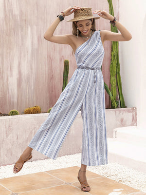Printed asymmetric palazzo jumpsuit in black or white, casual chic style.