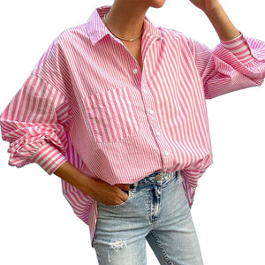 Pink and white striped oversized button-down shirt with a pocket and cuffed sleeves.