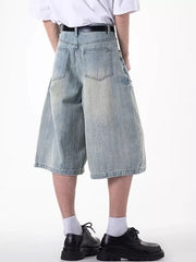 Relaxed fit light blue denim shorts with coin pocket and distressed details.