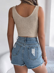 Khaki knit crop top with textured pattern and scoop neck, paired with distressed denim shorts.