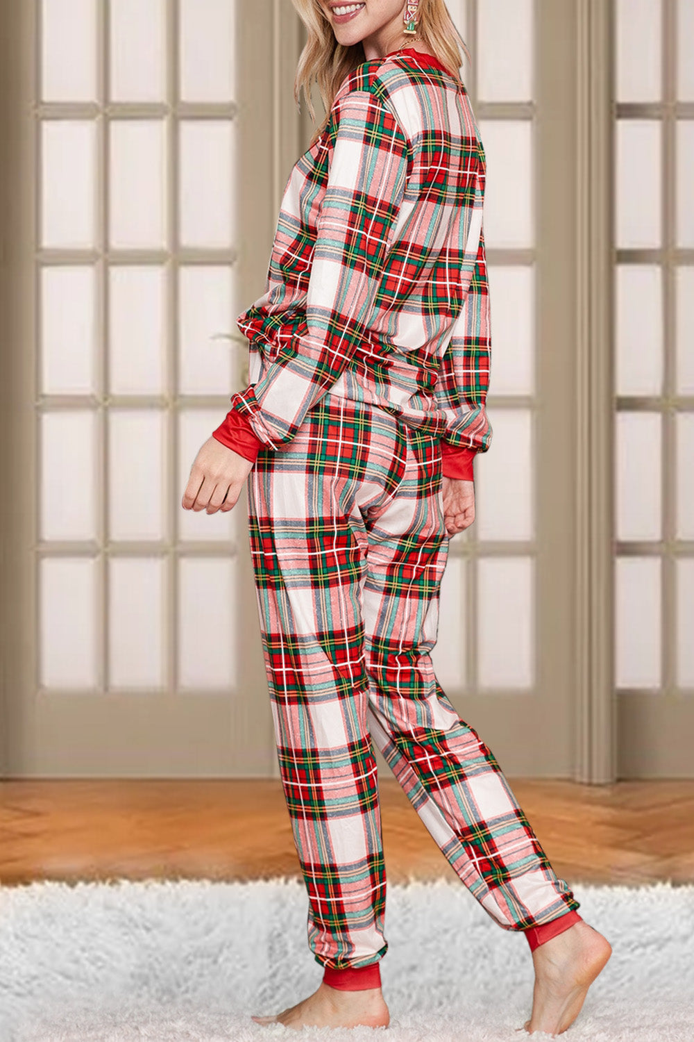Festive plaid loungewear set with red trim, long sleeves, and pants.