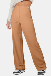Caramel wide leg trousers with button detail on the side.