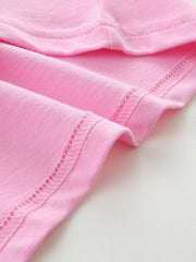 Pink cotton toddler t-shirt with cap sleeves and detailed stitching.