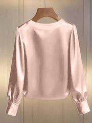 Pearl trim round neck pink satin blouse with long sleeves and button cuffs