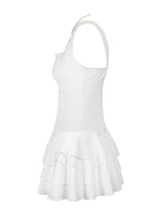 White mini dress with fitted bodice and tiered ruffled hem