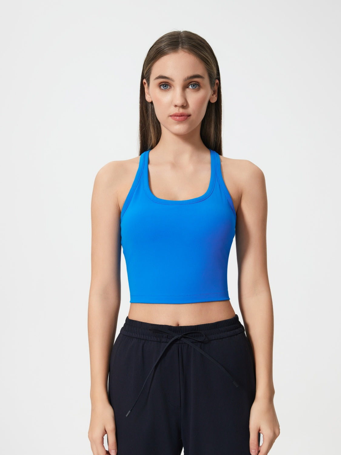 Sculpted racerback crop tank in royal blue with a scoop neckline.