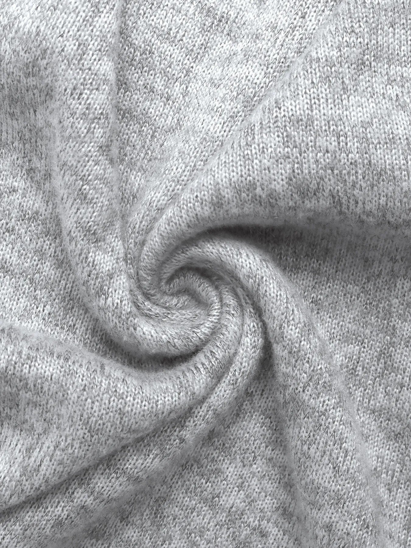 Light gray knit maxi dress fabric detail with a V-neckline and lace accents.