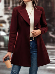 Burgundy wool coat with flared hemline, button closure, and notched lapels.
