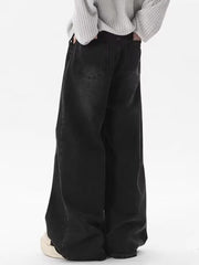 Men's black vintage wash wide-leg jeans, 100% cotton.