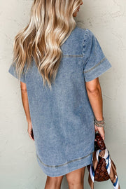 Light blue denim mini dress with short sleeves and a casual fit.