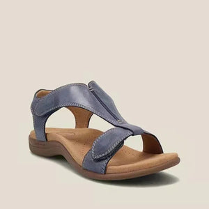 Navy leather T-strap comfort sandals with adjustable straps and a cushioned footbed.