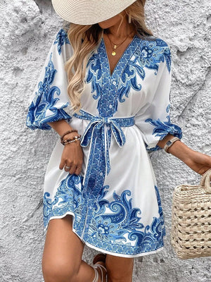 Blue paisley mini dress with waist tie and billowy sleeves