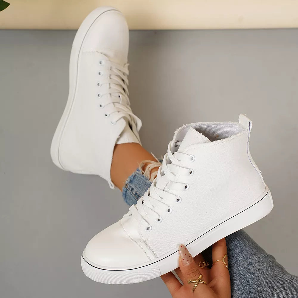 White high-top lace-up sneakers with frayed canvas detail and rubber toe cap.