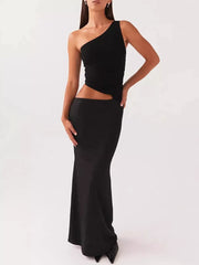 Black one-shoulder cutout maxi dress with a fitted skirt.