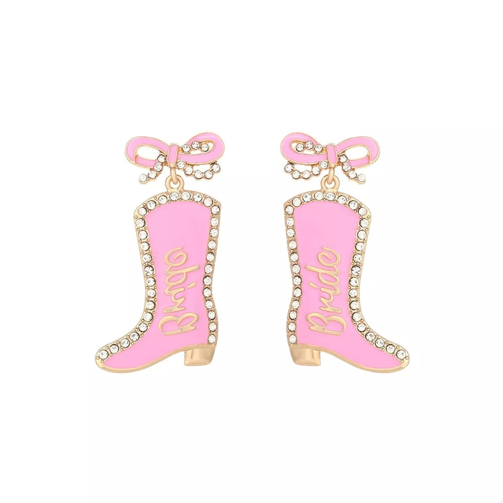 Pink cowboy boot dangle earrings with crystal trim and "Bride" text.