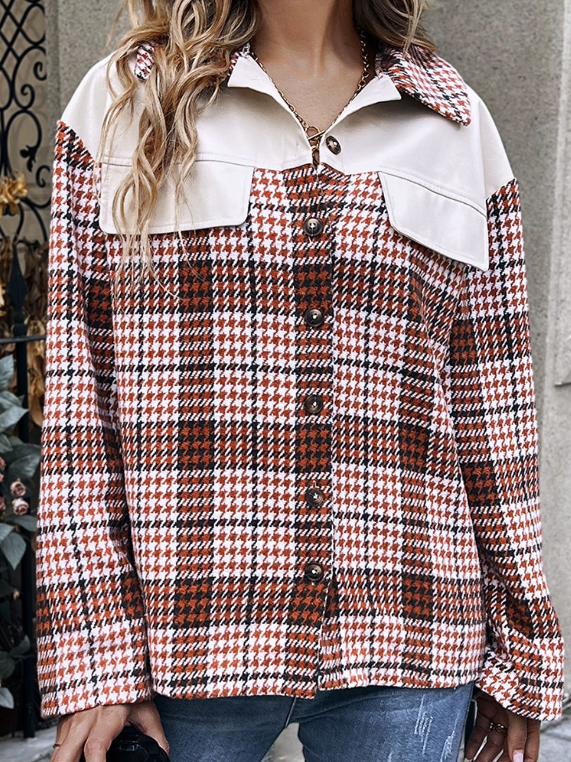 Houndstooth plaid shacket in deep red with contrast faux leather collar and chest pockets.