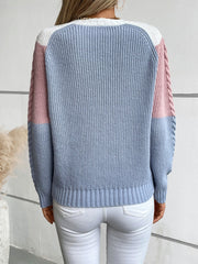 Chevron cable knit sweater in pastel blue, blush pink, and white with braided sleeve detail.
