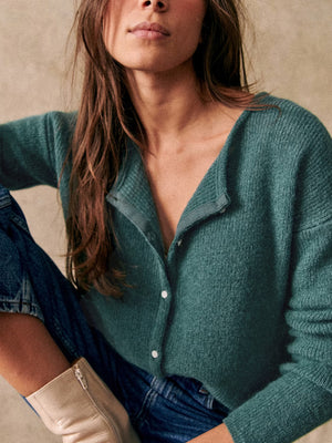 Turquoise cashmere cardigan with plunging neckline and button front