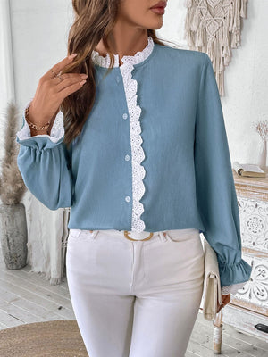 Light blue button-up blouse with lace trim on collar, placket, and cuffs.