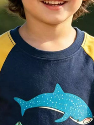 Navy cotton t-shirt with yellow raglan sleeves and a blue spotted shark graphic.
