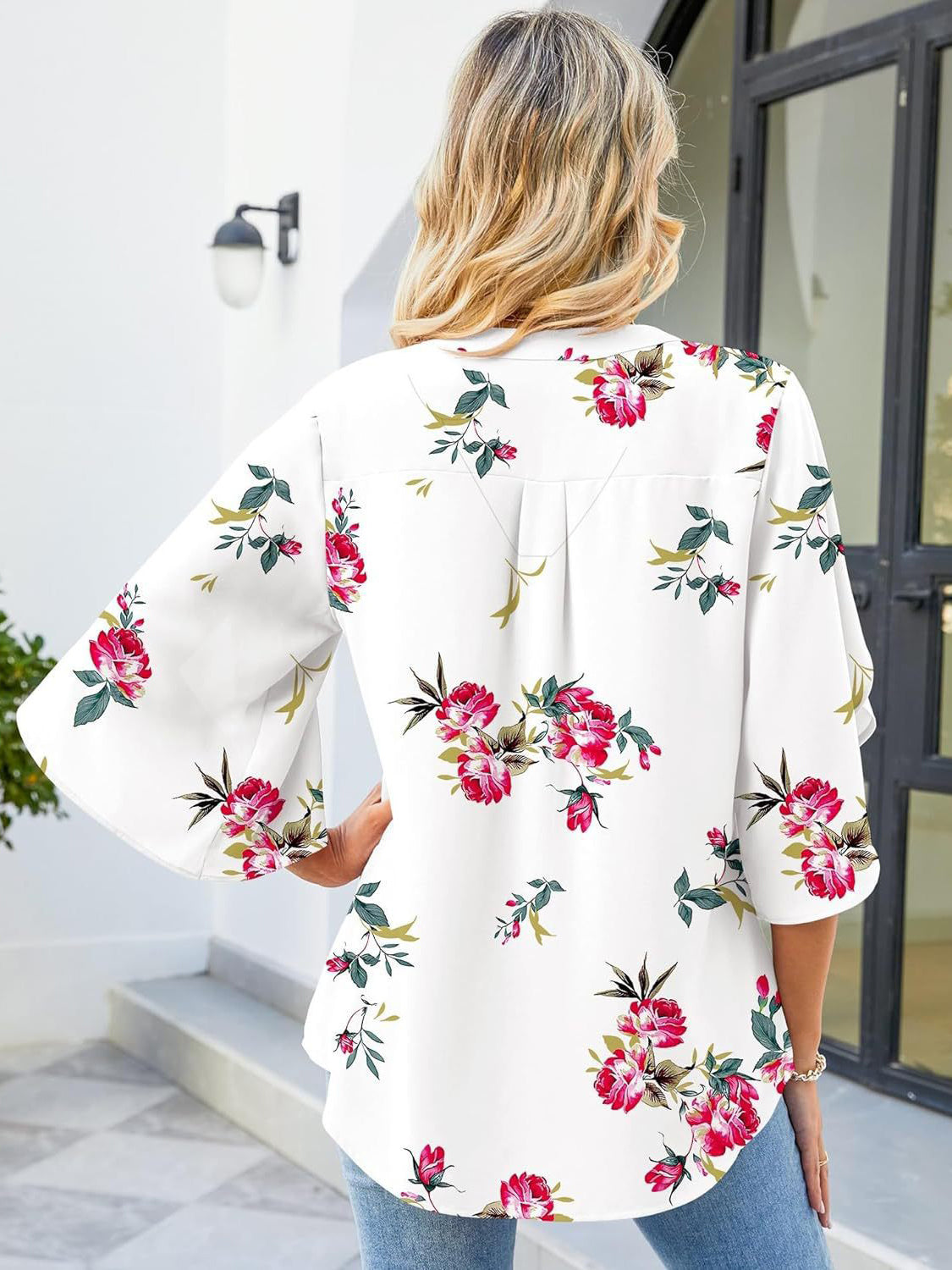 White floral print blouse with flutter sleeves and V-neck