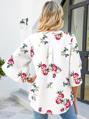 White floral print blouse with flutter sleeves and V-neck
