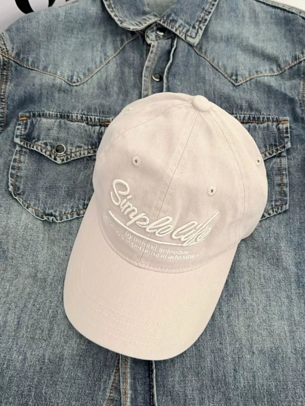 Off White cotton baseball hat with cursive "Simple life" embroidery