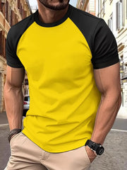 Colorblock raglan tee in yellow with black sleeves, crew neck, and short sleeves.