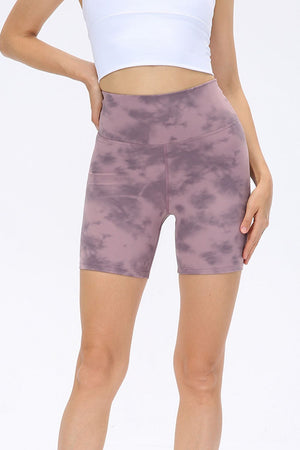 Mauve tie-dye bike shorts with a high waist and sculpting fit.