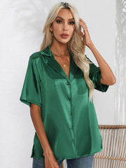 Dark green satin tie-front collared shirt with short sleeves and button front.