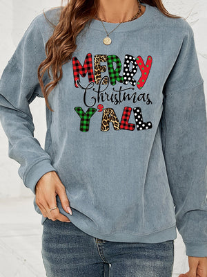 Light blue corduroy sweatshirt with Merry Christmas Y'all graphic in buffalo plaid, leopard, and polka dot patterns.