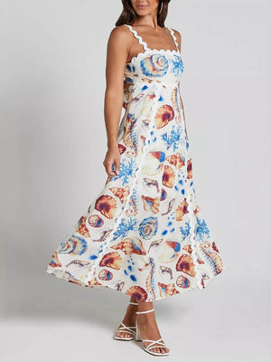 Seashell Elegance midi dress with scalloped trim and seashell print.