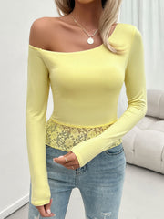 Light yellow off-shoulder blouse with lace trim detail
